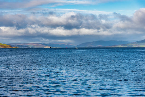istock Looking Over to Rothesay and Dunoon from Largs Scotland and a Dramatic Winters Sky. 1284280552