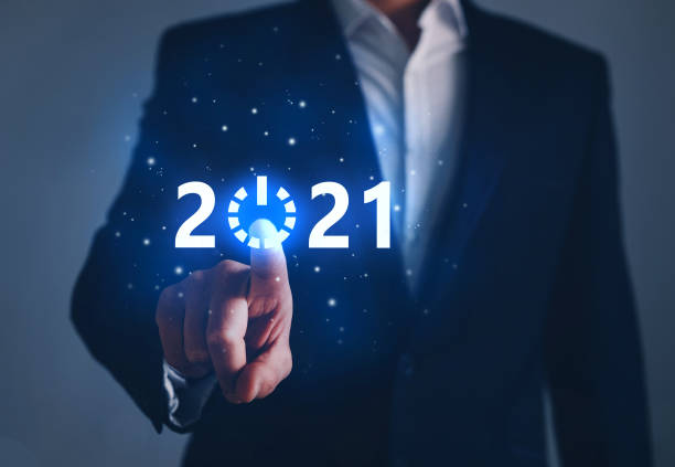 istock Businessman pointing START future button of year 2021 1284280862