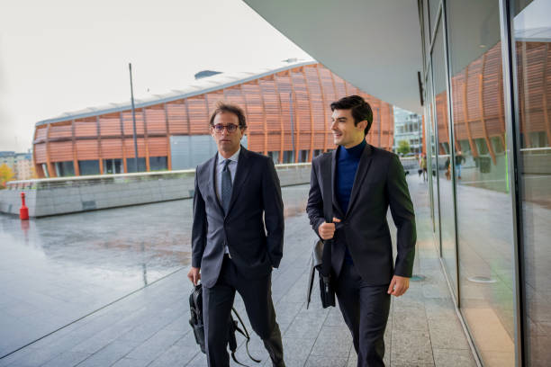 istock Business colleagues chatting on way for a office 1284284047