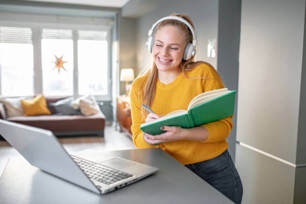 istock A young cheerful woman attends online classes 1284284574