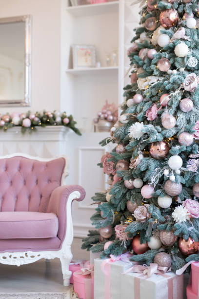 istock Interior of bright modern living room with fireplace and comfortable sofa decorated with Christmas tree and gifts 1284286737