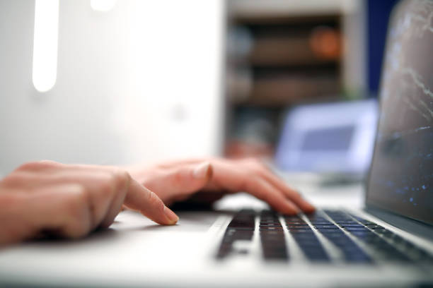 istock Business Person Typing With a Computer Keyboard 1284287058