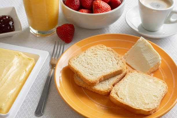 istock Breakfast table with butter, toasts, jam and strawberries 1284289661