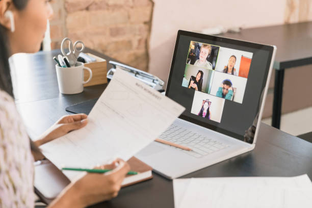Teacher quizzes students as they learn virtually during pandemic