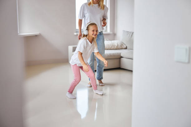 istock Funny small miss resting with mother in home at the quarantine 1284291244