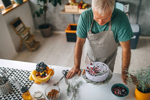istock Man with fresh homemade cake in kitchen 1284294979