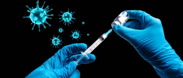 istock Hand holding viol with vaccine against corona virus. 1284295666