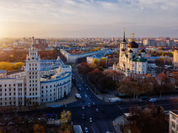 Evening autumn Voronezh cityscape. Tower of management of south-east railway and Annunciation Cathedral at sunset.