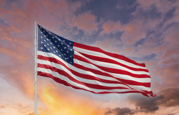istock American Flag on Brilliant Sky 1284299936