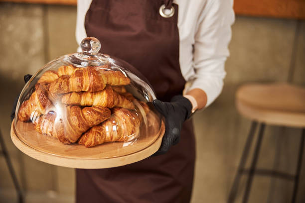 istock Fresh pastry in the bakery under the glass lid 1284301604