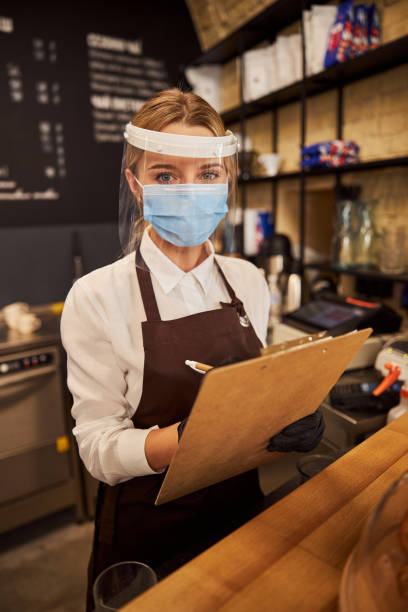 istock Confident Caucasian waitress working in quarantine conditions 1284301608