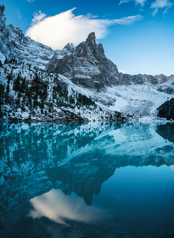 Lago di Sorapis lake, Dolomite Alps, Italy. Beautiful natural landscape at the winter time. Reflections on water surface.