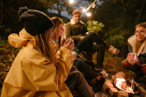 istock Friends drinking mulled wine by the campfire 1284304391