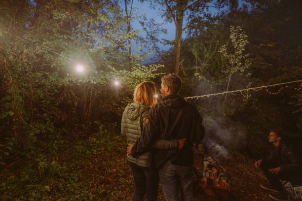 istock Couple at a campfire night party 1284307932