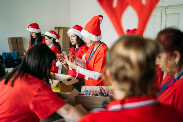 istock Female charity team during their work by making presents 1284308338