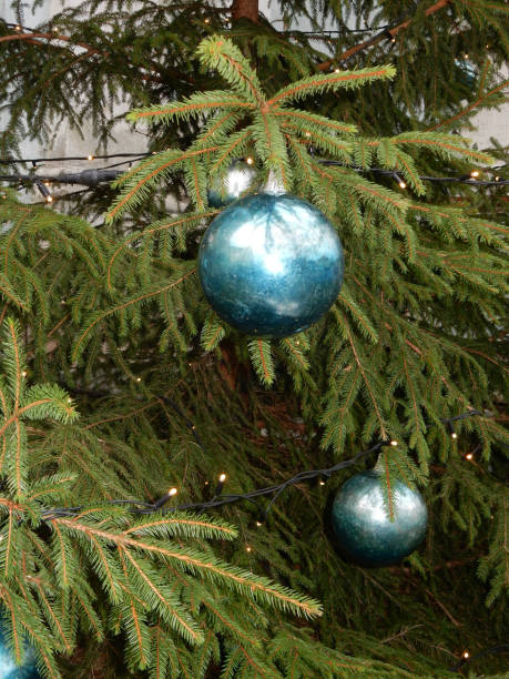 istock christmas decorations turquoise balls on street spruce, selective focus. 1284308345