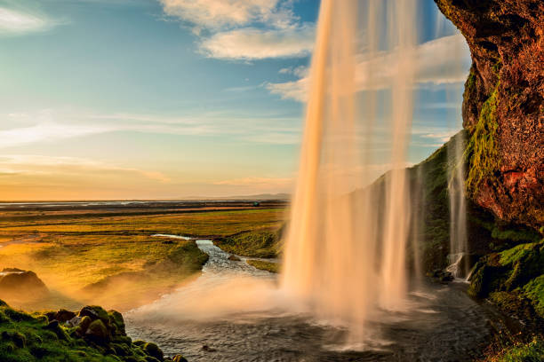 istock Seljalandsfoss waterfall at sunset, Iceland 1284310388