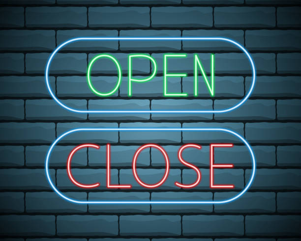 istock Neon green open and red close glowing signs in geometric shape on a brick wall background. Vector illustration. 1284310566