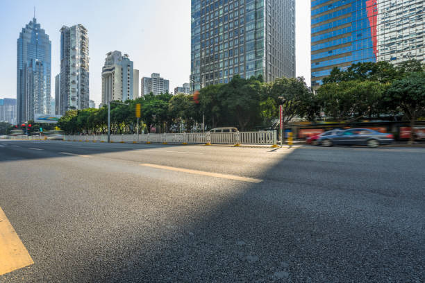 istock empty road and modern office block buildings against sky, china 1284312947
