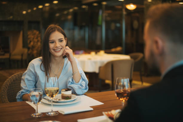 istock Cheerful man having fun with his girlfriend in a restaurant 1284314523