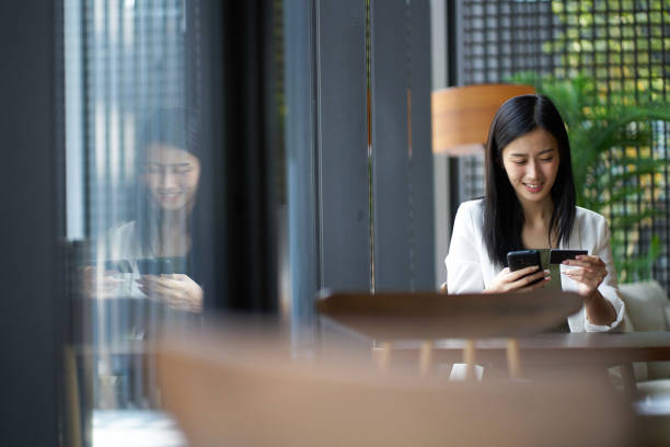 istock Chinese woman relaxing in a cafe 1284318612