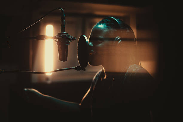 A girl singing in a recording studio