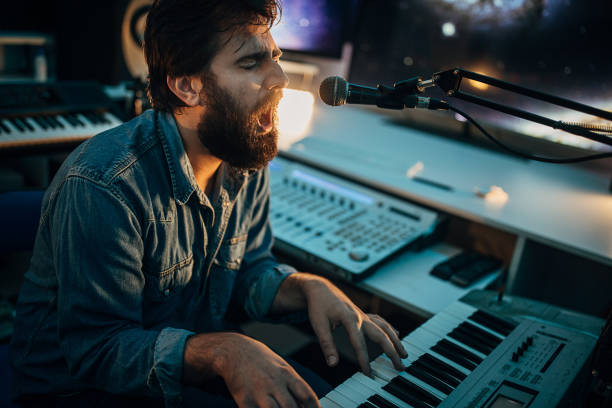 istock One young man working on a new song in music studio 1284320452