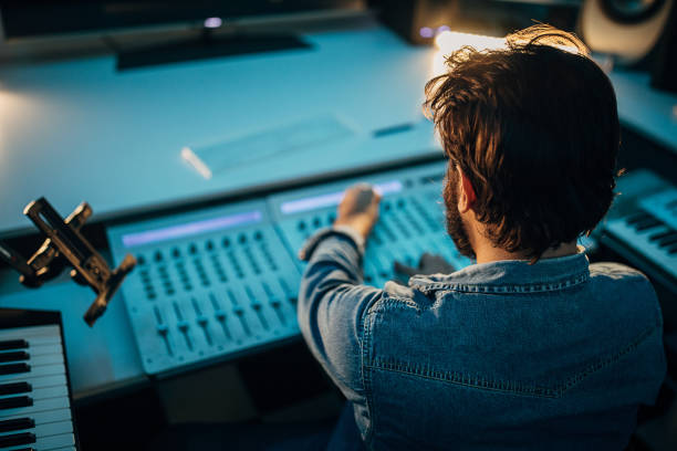 istock One male producer working in professional studio 1284320475