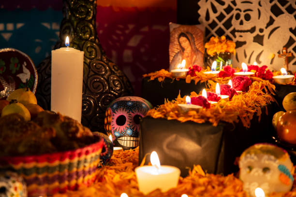 Colorful skull on colorful traditional Day of the Dead "ofrenda" Colorful skull on colorful traditional Day of the Dead "ofrenda" in Puebla, Pue., Mexico mexican day of the dead stock pictures, royalty-free photos & images
