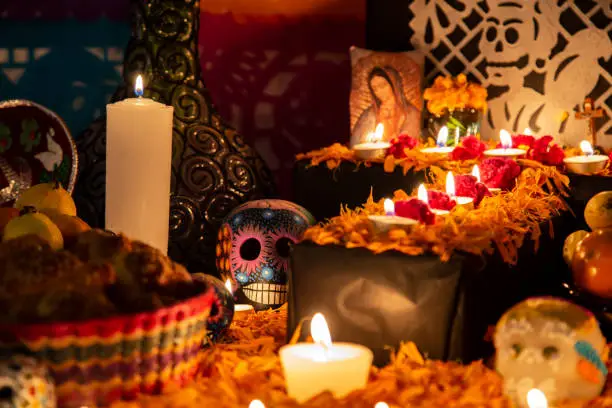 Colorful skull on colorful traditional Day of the Dead "ofrenda" in Puebla, Pue., Mexico
