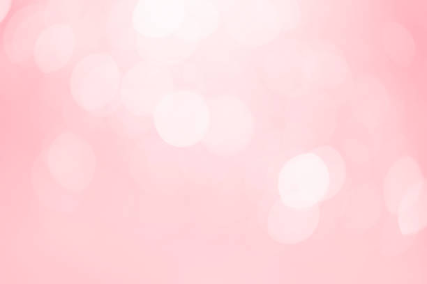 istock White bokeh defocus glitter blur on pink background. bokeh abstract background. 1284328781