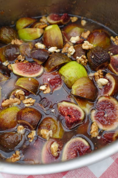 istock Fig and walnut jam being prepared in a pan before cooking  Homemade jam 1284332273