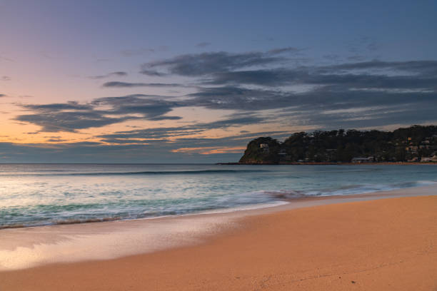 istock Sunrise at the seaside with headland and beach 1284333424