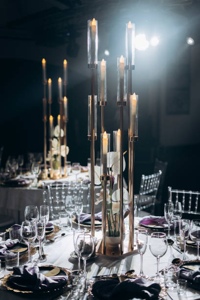 istock Solemn wedding table setting with glasses and candles in a restaurant 1284341339