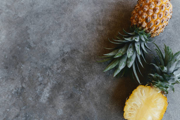 istock Pineapple on a stone table. Tropical Fruits. 1284342374