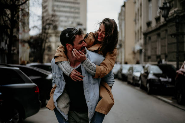 istock Piggyback ride down the street 1284346424