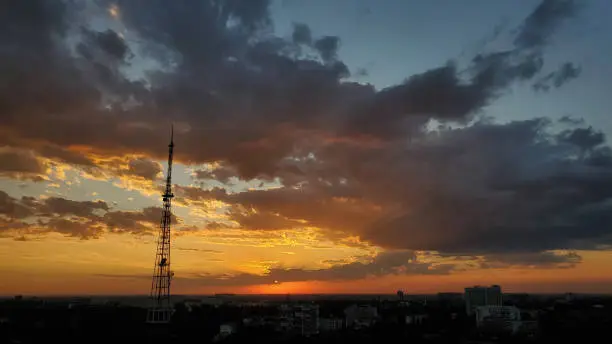 Photo of Dramatic stormy sky while sunset over city