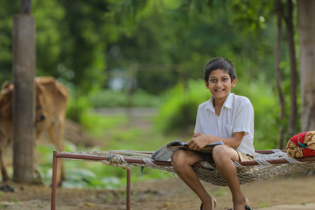 istock Cute Indian child studying at home. 1284350259