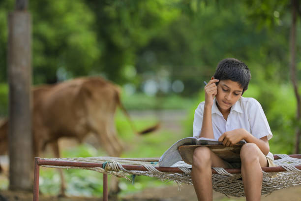 istock Cute Indian child studying at home. 1284350388