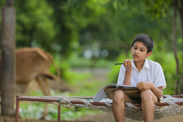 istock Cute Indian child studying at home. 1284350424