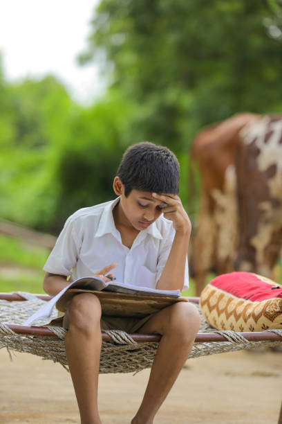 istock Cute Indian child studying at home. 1284351123