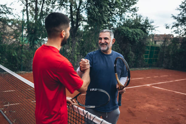 istock playing tennis outdoor 1284352402