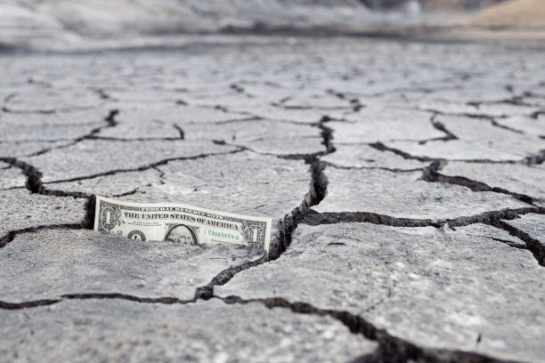 istock money and cracked ground perspective bottom view 1284355728
