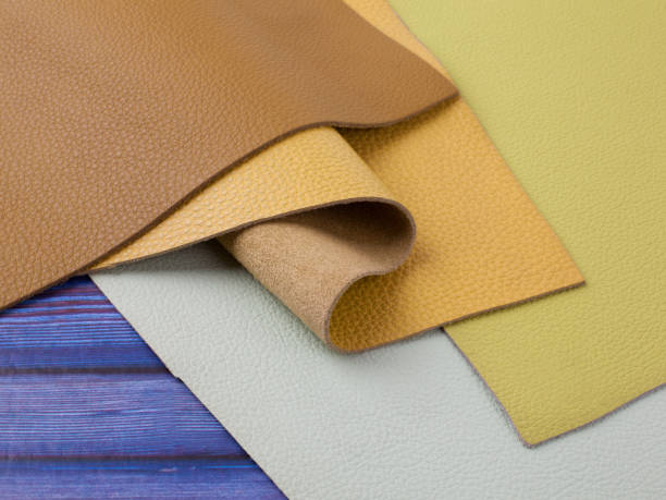 istock Natural leather textures samples on blue wooden background 1284356001