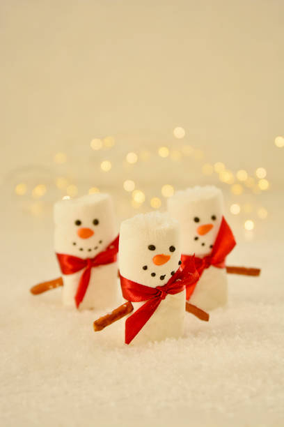 istock Marshmallow Snowmen Christmas abstract mockup with bokeh lights 1284366550