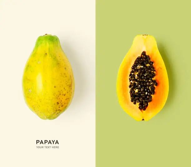 Fresh papaya fruits creative layout. Healthy eating, dieting and food concept. Flat lay, top view. Design elements, color card with copy space