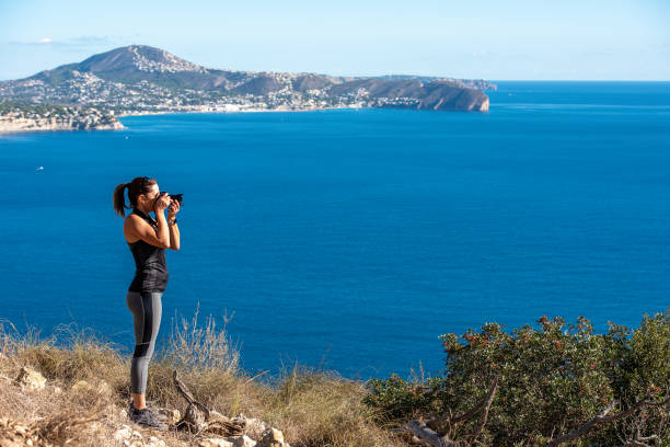 istock Woman hiking up the mountain 1284366723