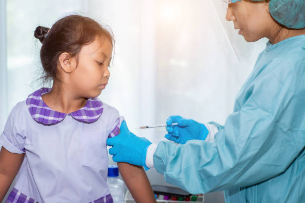 istock Immunization and vaccination for flu shot, influenza virus, HPV virus or Covid-19 prevention with young child girl in the school having vaccine injection for World immunization week and International HPV awareness day. 1284368079