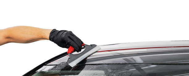 istock A man cleaning car. Car detailing concept. Cleaning with plastic sponge. 1284370087