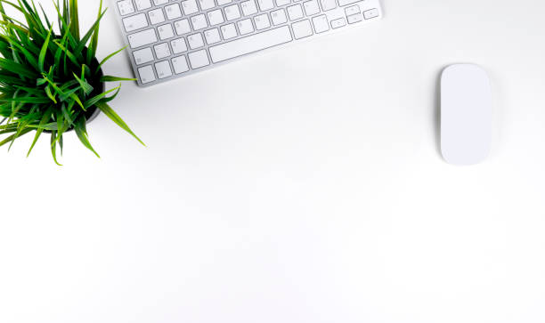 istock Office desk with copy space. Digital devices wireless keyboard and mouse on office table. Top view 1284370094
